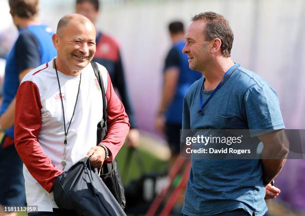 Eddie Jones, , the England head coach talks to Canberra Raiders head coach, Ricky Stuart during the England training session held Jissouji multi...