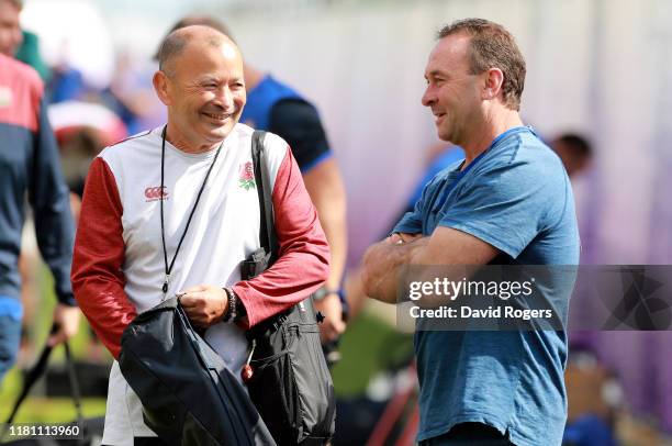 Eddie Jones, , the England head coach talks to Canberra Raiders head coach, Ricky Stuart during the England training session held Jissouji multi...