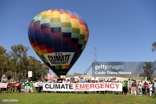 Hot air ballon with 'Climate Emergency' on it, in front of Parliament House on October 15, 2019 in Canberra, Australia. Protesters are demanding...