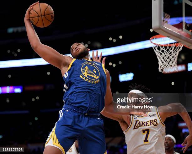 Omari Spellman of the Golden State Warriors grabs a rebound in front of JaVale McGee of the Los Angeles Lakers during the first half at Staples...