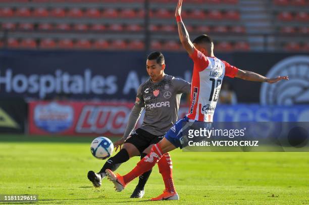 Luis Reyes of Atletico San Luis vies for the ball with Ricardo Chavez of Necaxa during a Mexican Apertura 2019 tournament football match at the...