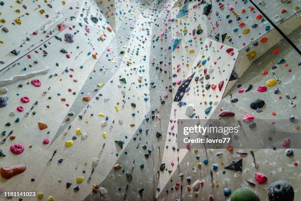 climbing wall indoor - climbing wall stock pictures, royalty-free photos & images