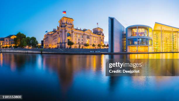 panoramic view of the german parliament building and the river spree at twilight, germany. - spree river stock pictures, royalty-free photos & images