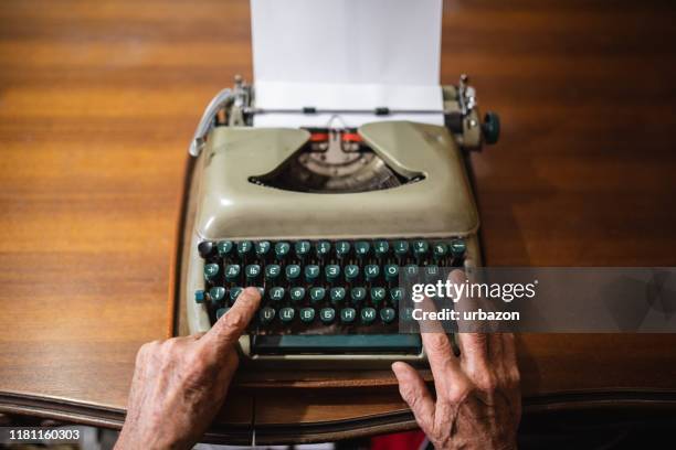 using typewriter at home - typewriter alphabet stock pictures, royalty-free photos & images