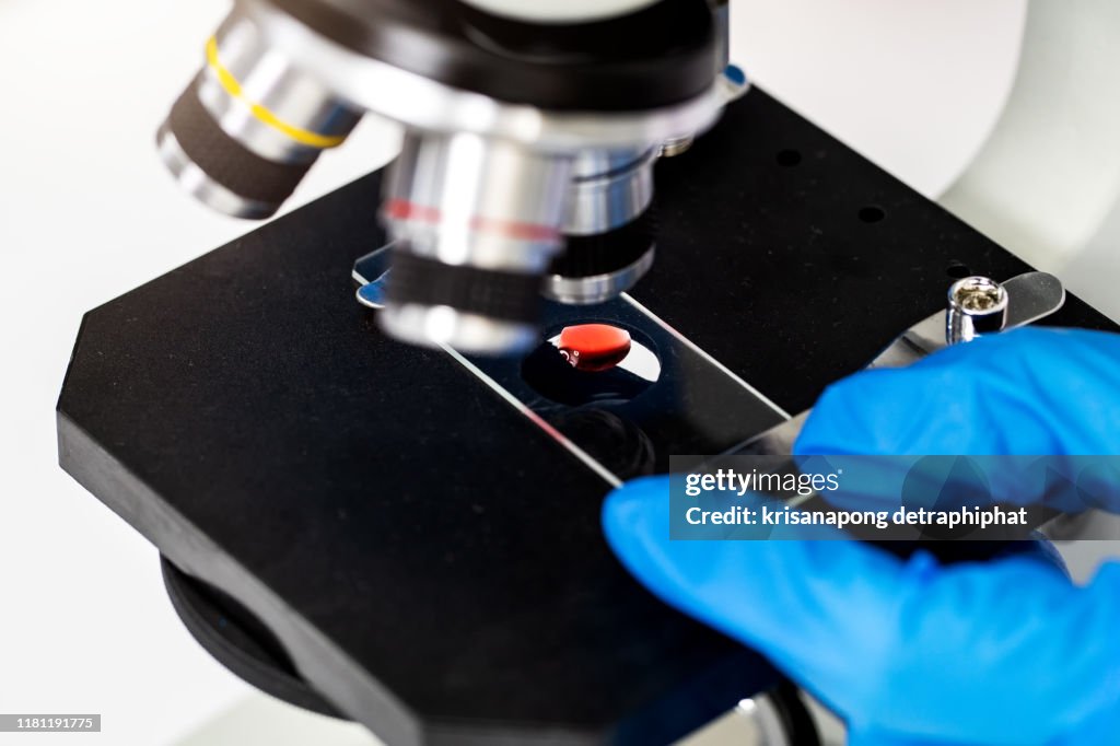 A microscope in a laboratory. scientist doing some research.