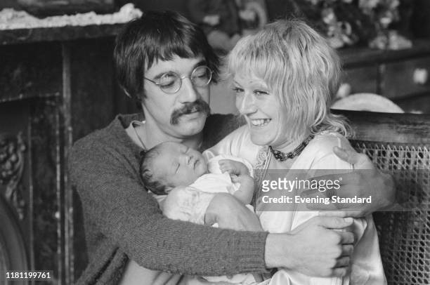 English actor Roger Lloyd-Pack and his wife Sheila Ball hold their newborn daughter Emily Lloyd-Pack in London in October 1970.