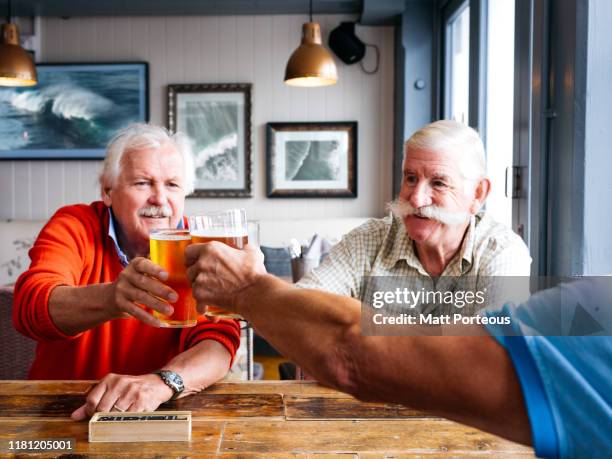 old men at the pub - channel islands england stock pictures, royalty-free photos & images