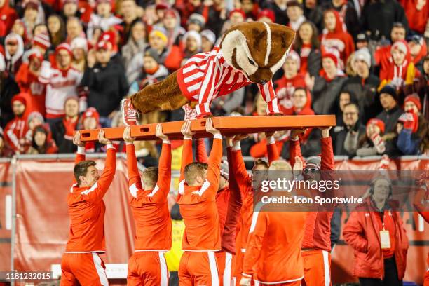 Wisconsin mascot Bucky Badger does pushups to celebrate a score during a Big Ten college football game between the University of Wisconsin Badgers...