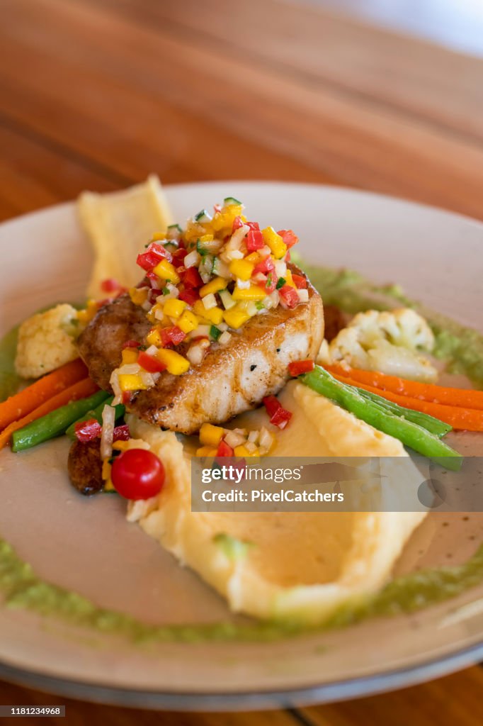 Line fish of the day served with mango salsa