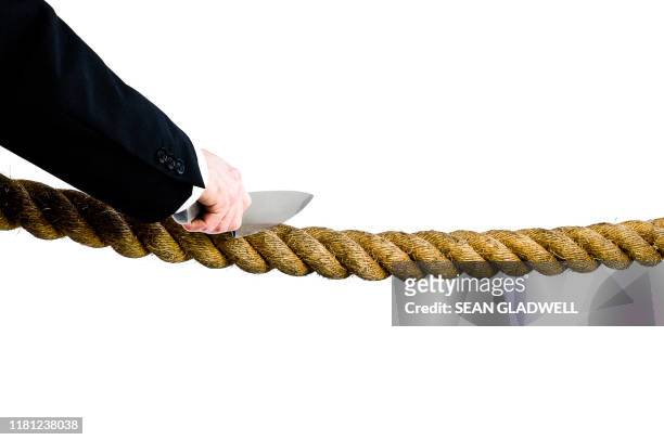 businessman cutting rope - man cutting wire stockfoto's en -beelden