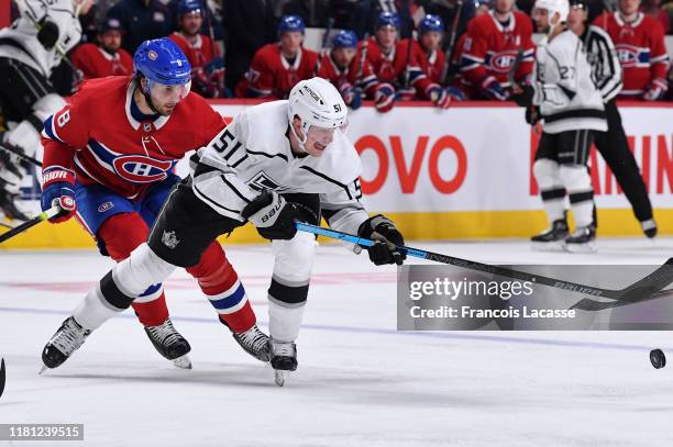 Austin Wagner of the Los Angeles Kings skates for the puck while being pressured by Ben Chiarot of the Montreal Canadiens in the NHL game at the Bell...