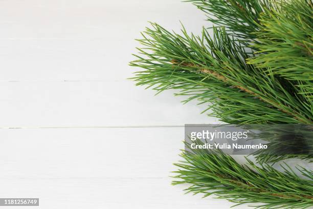 christmas wooden background with natural decoration, fir tree and cones. rustic wooden background, view from above. flat lay, top view. - christmas border stock pictures, royalty-free photos & images