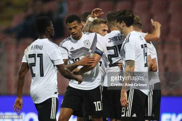 Lukas Nmecha of Germany celebrates as he scores his team's second goal with team mates during the UEFA U21 Championship Qualifying match between...