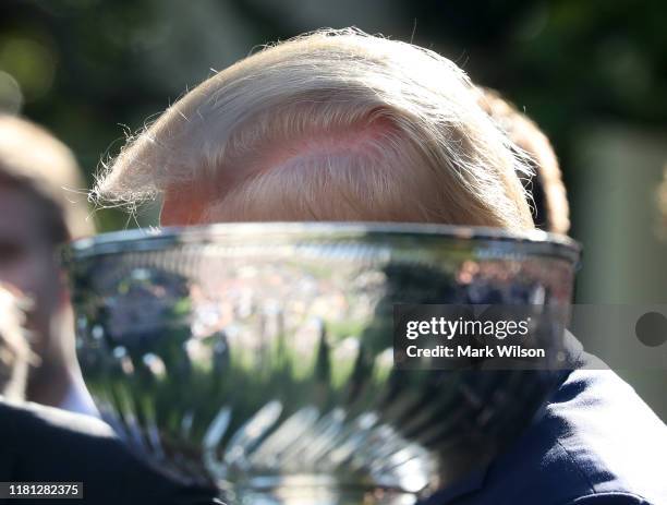 President Donald Trump stands next to the Stanley Cup during an event to honor the 2019 Stanley Cup Champions, St. Louis Blues in the Rose Garden at...