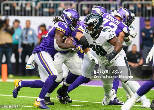 Dalvin Cook of the Minnesota Vikings runs with the ball in the first quarter of the game against the Philadelphia Eagles at U.S. Bank Stadium on...