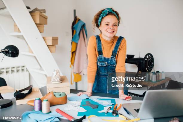 young shoemaker at her workshop - leather notebook stock pictures, royalty-free photos & images