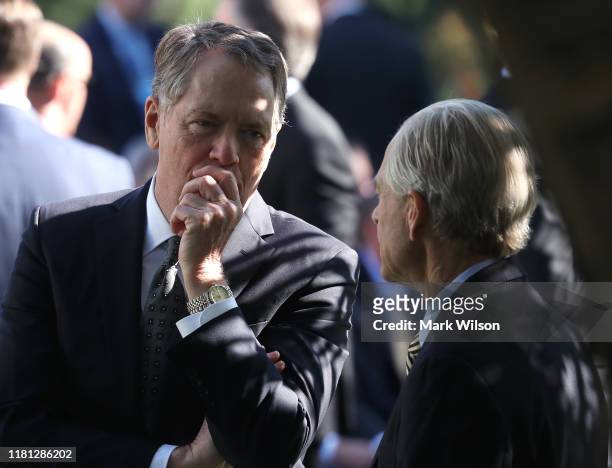 Trade Representative Robert Lighthizer , talks with White House trade adviser Peter Navarro before an event to honor the 2019 Stanley Cup Champions,...