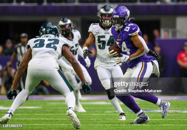 Irv Smith of the Minnesota Vikings runs with the ball after making a catch in the fourth quarter of the game against the Philadelphia Eagles at U.S....