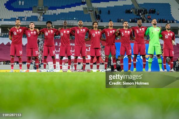 The Qatar national team sing the national anthem before the joint 2022 FIFA World Cup and 2023 Asian Cup Qualifier between Qatar and Oman at the Al...