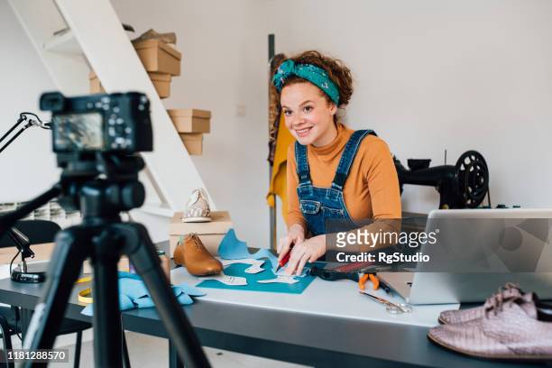 young woman making vlog about making shoes - film set stock pictures, royalty-free photos & images