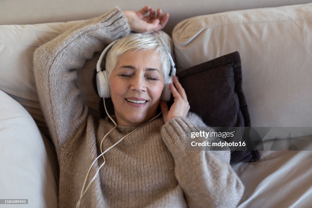 Senior woman listening to music