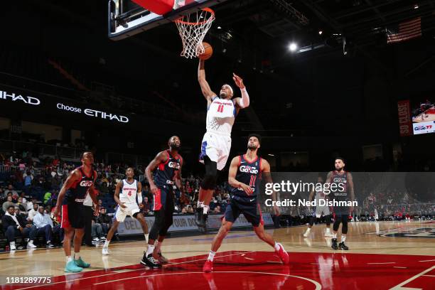 Tre'Shawn Thurman of the Grand Rapids Drive dunks against Noah Allen of the Capital City Go-Go during a NBA G-League game at the Entertainment and...