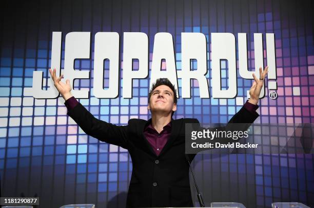 Professional sports gambler and former "Jeopardy!" champion James Holzhauer poses at the IGT booth during the trade show debut of two...