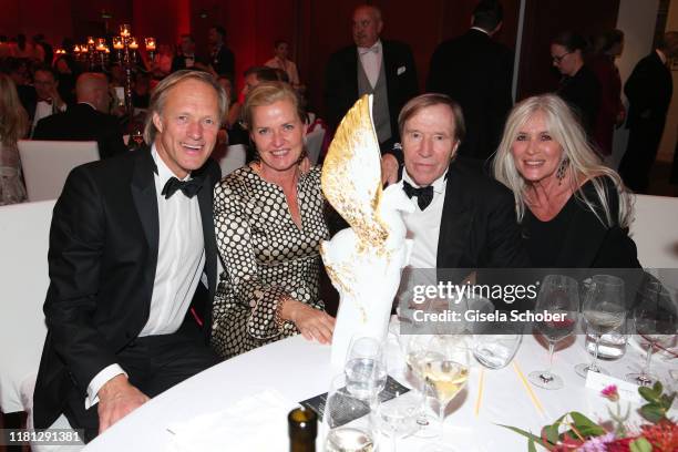 Gerhard Delling and his girlfriend Vicki Hinrichs, Guenter Netzer, Elvira Netzer and Pegasos Award during the German Sports Media Ball at Alte Oper...