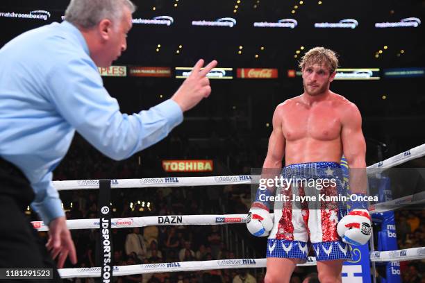 Referee Jack Reiss deducts 2 points from the score card of Logan Paul after he punched KSI after a knock down in their pro debut fight at Staples...