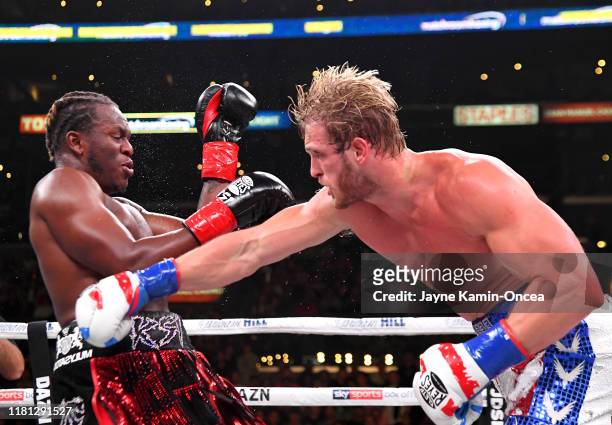 Logan Paul and KSI exchange punches during their pro debut fight at Staples Center on November 9, 2019 in Los Angeles, California. KSI won by...