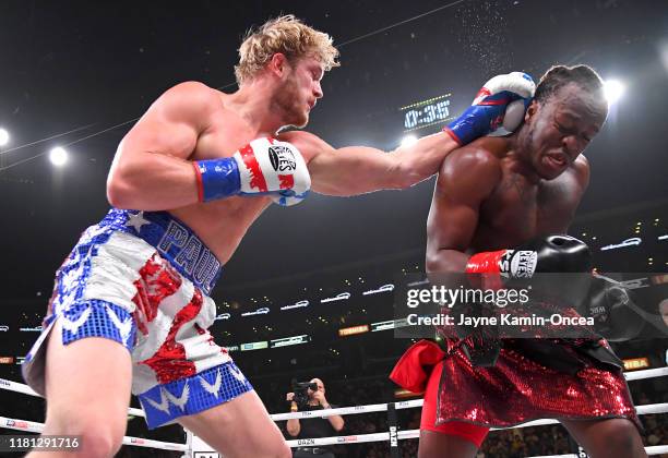 Logan Paul and KSI exchange punches during their pro debut fight at Staples Center on November 9, 2019 in Los Angeles, California. KSI won by...