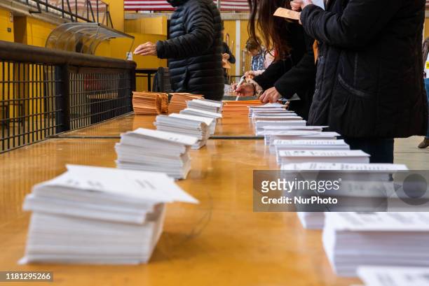Person votes with his ballot at the polling station in Girona, Spain, on 10 November 2019 for the presidential elections of Spain.