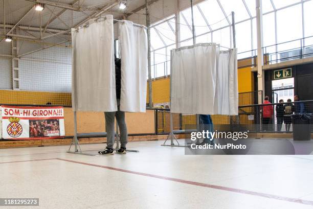 People vote at the polling station in Girona, Spain, on 10 November 2019 for the presidential elections of Spain.