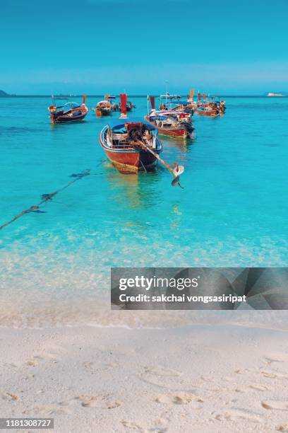 idyllic view of longtail boats on beach in koh lipe island, thailand, asia - ko lipe stock pictures, royalty-free photos & images