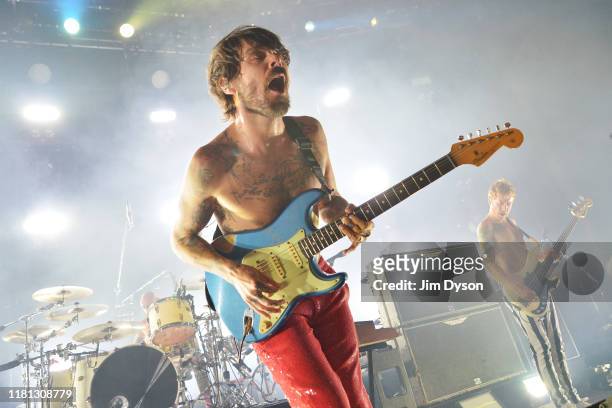 Simon Neil and James Johnston of Biffy Clyro perform live on stage during a one-off Q Awards show at The Roundhouse on October 15, 2019 in London,...