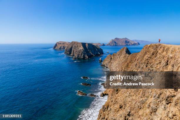 a woman is photographing the view at inspiration point on east anacapa island - channel islands national park stock pictures, royalty-free photos & images