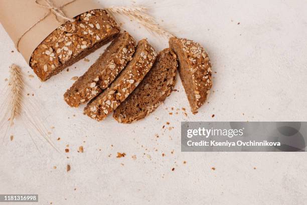 fresh bread on wooden table. top view with space for your text - integrale foto e immagini stock