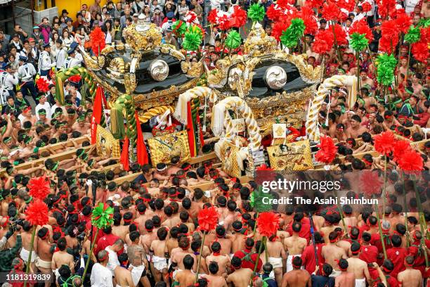 Japanese Shrine Parishioners of Mega jolt their Mikoshi, during a parade as part of the Nada No Kenka Matsuri at Matsubara Hachiman Shrine on October...