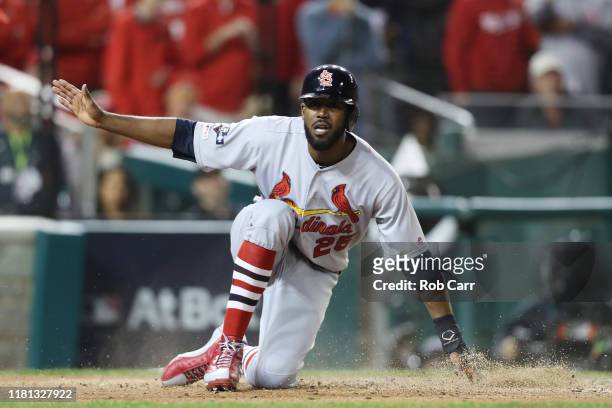 Dexter Fowler of the St. Louis Cardinals scores on a double by Carlos Martinez a in the fifth inning against the Washington Nationals during game...