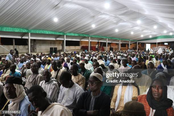 People gather to pray at the Omarienne Mosque during a celebration event marking Mawlid al-Nabi in Dakar, Senegal on november 09, 2019.