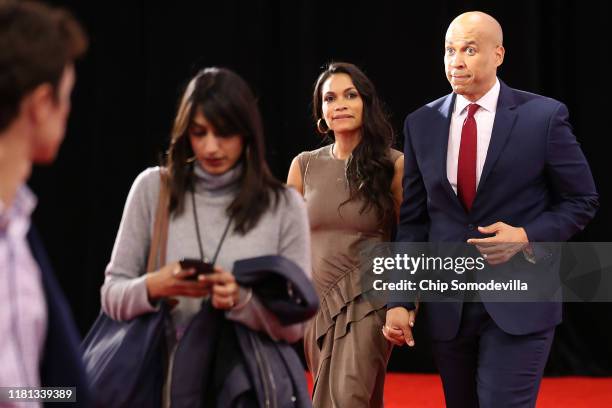 Sen. Cory Booker enters the Spin Room with his girlfriend Rosario Dawson after the Democratic Presidential Debate at Otterbein University on October...