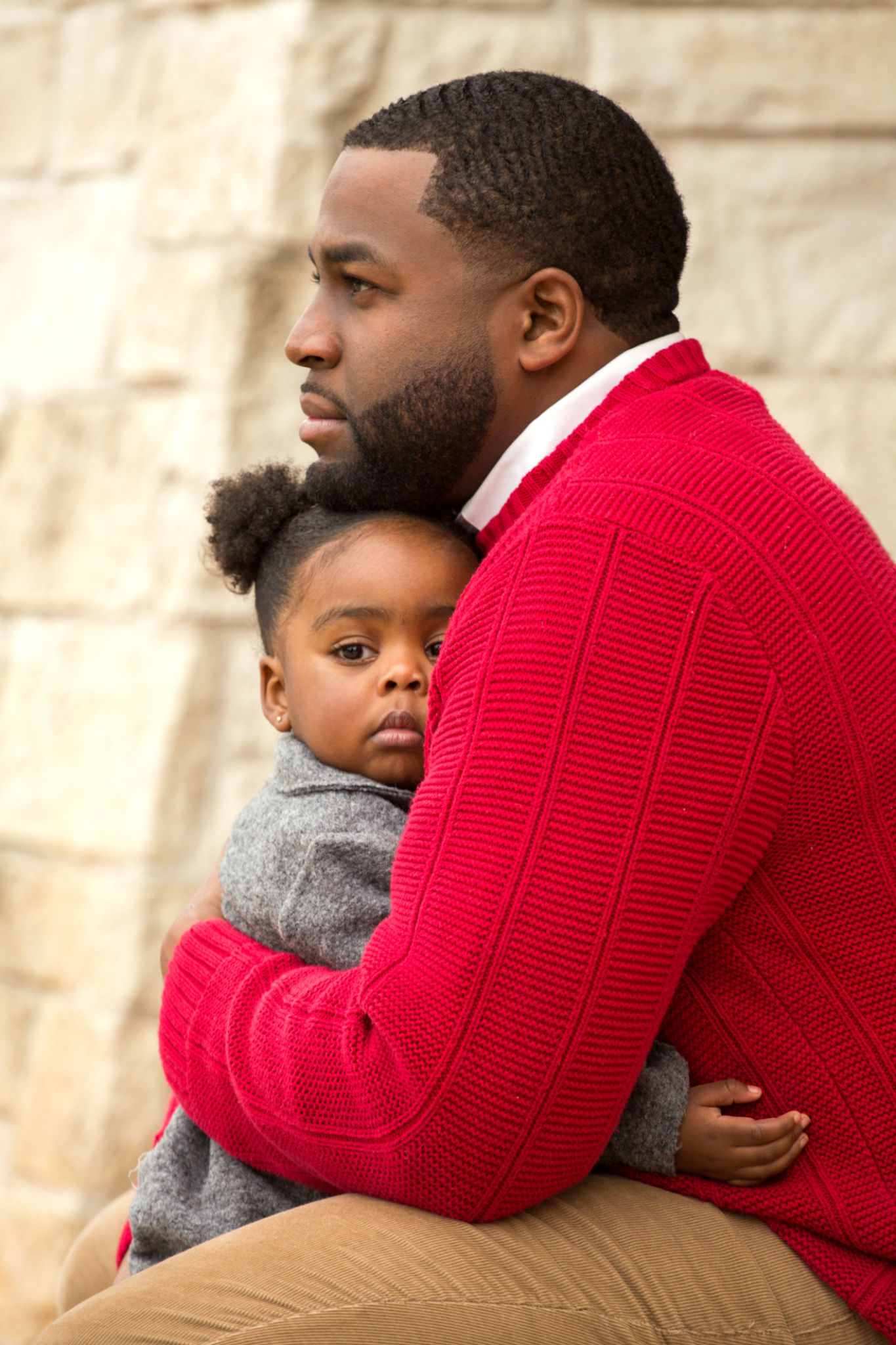African American father holding his daughter. African American father holding his daughter.