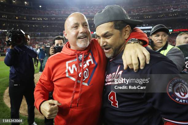 General manager Mike Rizzo and Manager Dave Martinez of the Washington Nationals celebrate after winning game four and the National League...