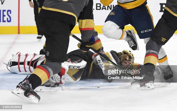 Marc-Andre Fleury of the Vegas Golden Knights loses his stick as he makes a diving save against the Nashville Predators in the third period of their...