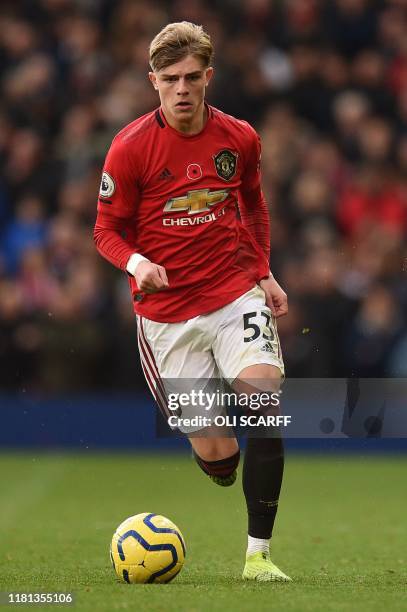 Manchester United's English defender Brandon Williams runs with the ball during the English Premier League football match between Manchester United...
