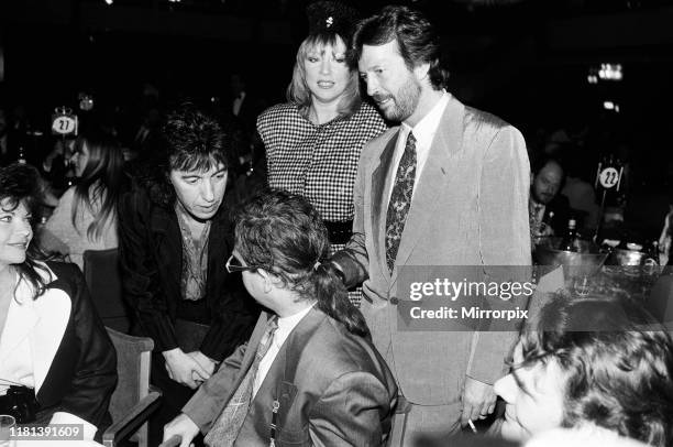 The Ivor Novello Awards at Gorsvenor House, London; pictured, Elton John's wife Renate, Bill Wyman, Pattie Boyd, Eric Clapton and Elton John. 7th...