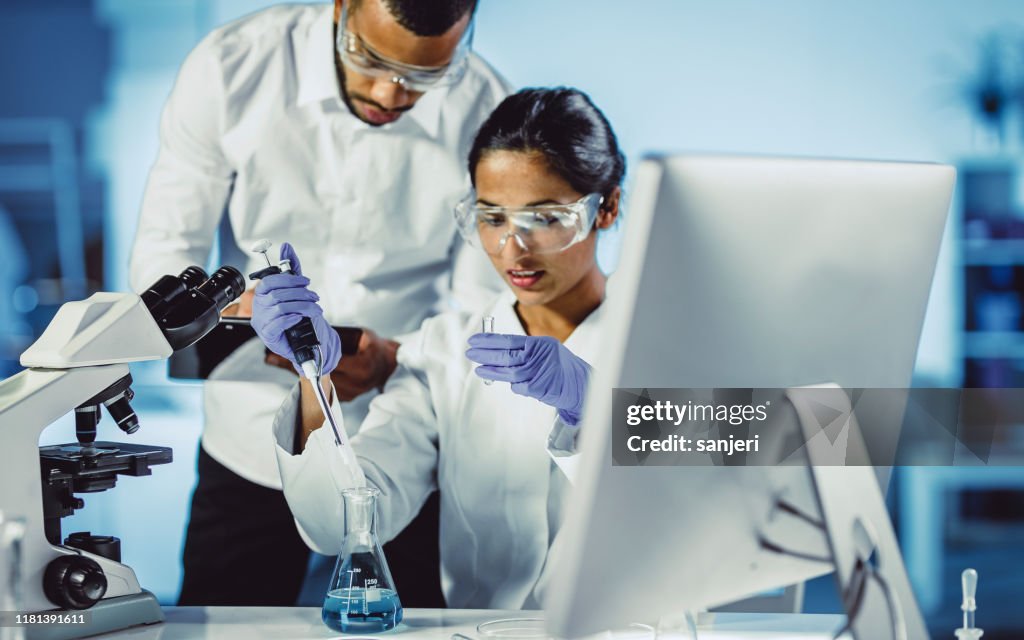 Working In Lab Scientists Working In The Laboratory High-Res Stock Photo - Getty Images