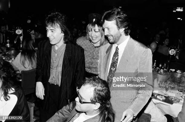 The Ivor Novello Awards at Gorsvenor House, London; pictured, Bill Wyman, Pattie Boyd, Eric Clapton and Elton John. 7th April 1986.