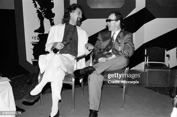 The Ivor Novello Awards at Gorsvenor House, London; pictured, Billy Connolly and Elton John. 7th April 1986.