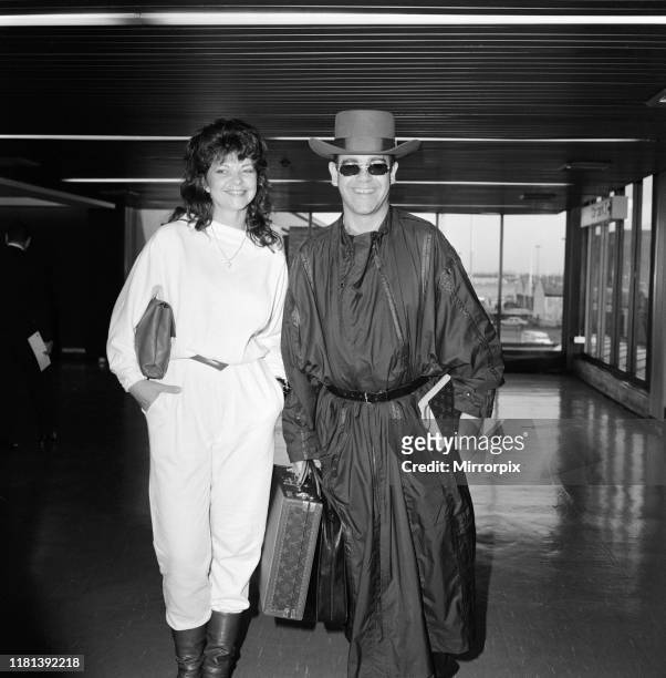 Elton John and his new wife Renate Blauel arriving at Heathrow Airport from hong Kong. 2nd April 1984.